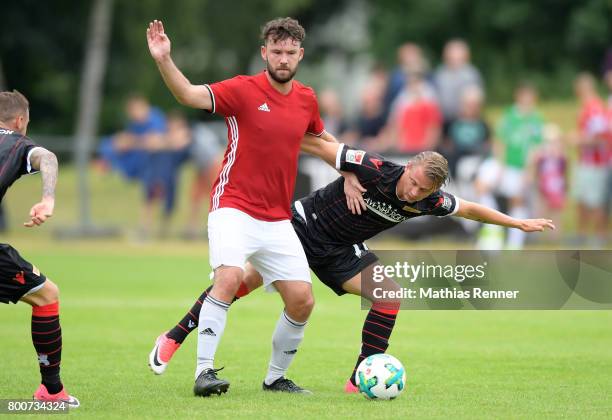 Thomas Rabe of Friedrichshagener SV and Simon Hedlund of 1 FC Union Berlin during the game between Friedrichshagener SV and 1 FC Union Berlin on june...