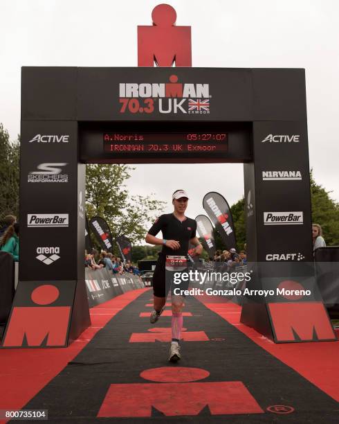 Third pace athlete Heather Fell from Great Britain arrives at the finish line during the Ironman 70.3 UK Exmoor at Wimbleball Lake on June 25, 2017...