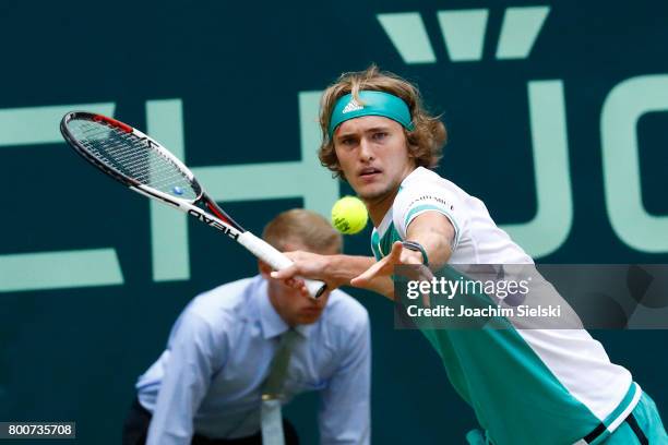 Alexander Zverev of Germany returns the ball during the men's singles match against Roger Federer of Suiss on Day 9 of the Gerry Weber Open 2017 at...