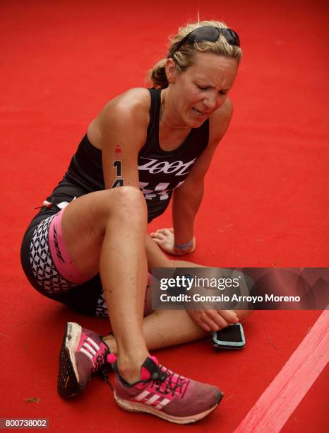 An athlete falls as she crosses the finish line during the Ironman 70.3 UK Exmoor at Wimbleball Lake on June 25, 2017 in Somerset, United Kingdom.