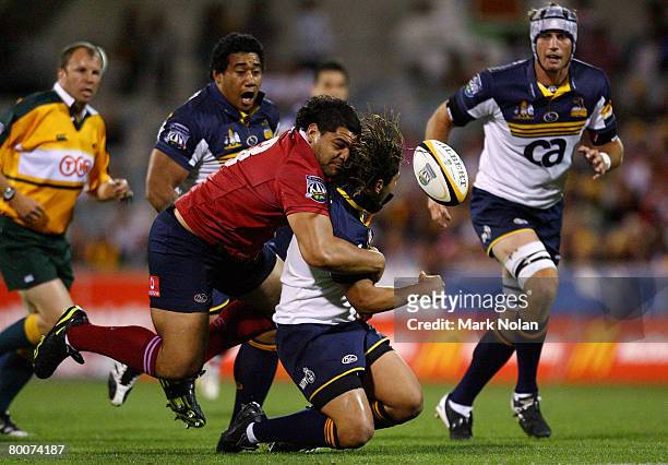 Rodney Blake of the Reds tackles Saia Faingaa of the Brumbies during the round three Super 14 match between the ACT Brumbies and the Queensland Reds...