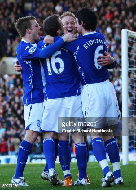 Mikael Forssell of City celebrates his teams opening goal with team mates during the Barclays Premier League match between Birmingham City and...
