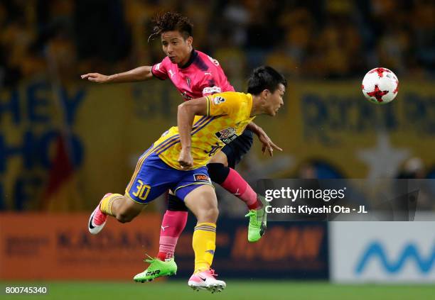 Riku Matsuda of Cerezo Osaka and Takuma Nishimura of Vegalta Sendai compete for the ball during the J.League J1 match between Vegalta Sendai and...