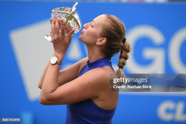 Petra Kvitova of Czech Republic kisses the Maud Watson trophy after beating Ashleigh Barty of Australia on day seven of The Aegon Classic Birmingham...