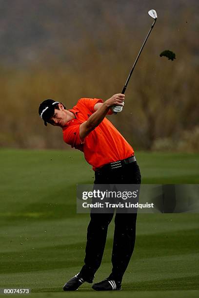 Justin Rose of England hits his second shot on the second hole during the first round matches of the WGC-Accenture Match Play Championship at The...