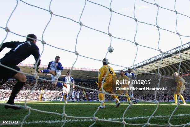 Mikael Forssell of City scores his teams opening goal past Paul Robinson of Spurs during the Barclays Premier League match between Birmingham City...
