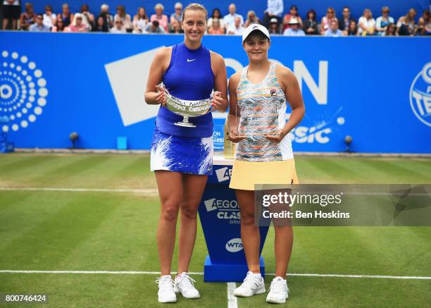 Petra Kvitaova of the Czech Republic and Ashleigh Barty of Australia pose with their trophies after their Women's Singles final match on day seven of...