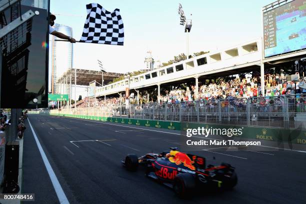 Daniel Ricciardo of Australia driving the Red Bull Racing Red Bull-TAG Heuer RB13 TAG Heuer takes the chequered flag and the win during the...