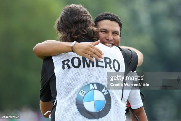 Andres Romero of Argentina embraces his caddie on the 18th green during the final round of the BMW International Open at Golfclub Munchen Eichenried...