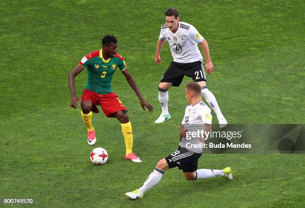 Andre Zambo of Cameroon is closed down by Sebastian Rudy and Joshua Kimmich of Germany during the FIFA Confederations Cup Russia 2017 Group B match...