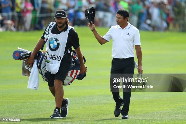 Andres Romero of Argentina acknowledges the crowd on the 18th hole during the final round of the BMW International Open at Golfclub Munchen...
