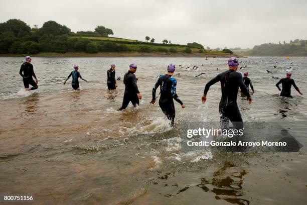 Athletes compete during the swimming course of the Ironman 70.3 UK Exmoor at Wimbleball Lake on June 25, 2017 in Somerset, United Kingdom.