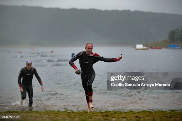 Athletes compete during the swimming course of the Ironman 70.3 UK Exmoor at Wimbleball Lake on June 25, 2017 in Somerset, United Kingdom.