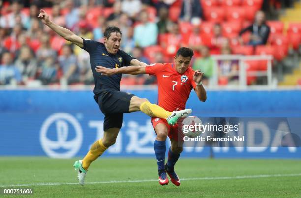 Mark Milligan of Australia attempts to stop Alexis Sanchez of Chile from scoring during the FIFA Confederations Cup Russia 2017 Group B match between...