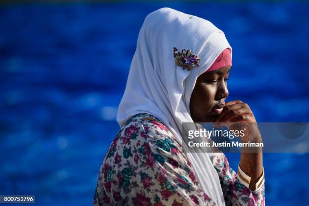 Asia Mada of Sharpsburg, Pa., waits for prayer to begin during an Eid al-Fitr celebration, marking the end of Ramadan, on June 25, 2017 in...