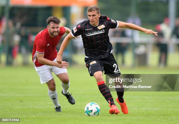 Thomas Rabe of Friedrichshagener SV and Grischa Proemel of 1 FC Union Berlin during the game between Friedrichshagener SV and Union Berlin on june...