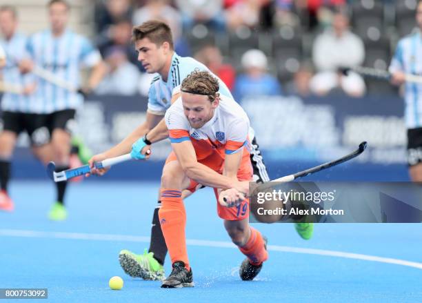 Bob de Voogd of the Netherlands and Gonzalo Peillat of Argentina battle for possession during the final match between Argentina and the Netherlands...