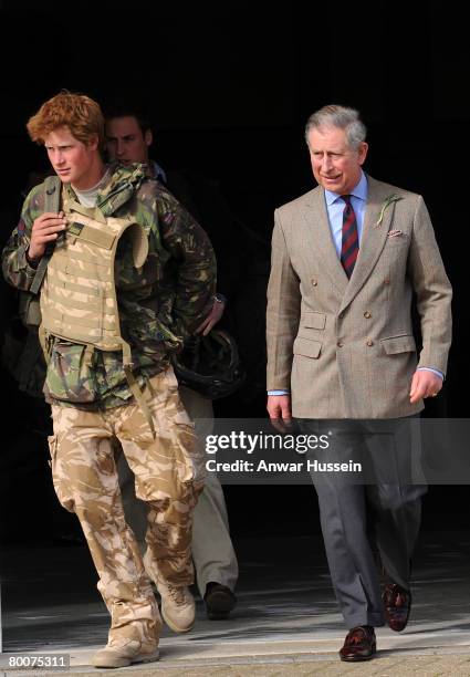 Prince Harry leaves the terminal at RAF Brize Norton with his father Prince Charles, Prince of Wales and brother Prince William following his return...