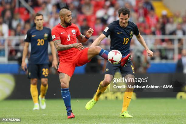 Arturo Vidal of Chile competes with Ryan McGowan of Australia during the FIFA Confederations Cup Russia 2017 Group B match between Chile and...