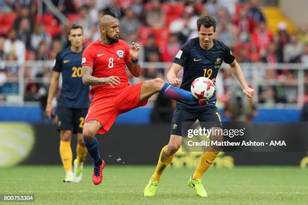 Arturo Vidal of Chile competes with Ryan McGowan of Australia during the FIFA Confederations Cup Russia 2017 Group B match between Chile and...