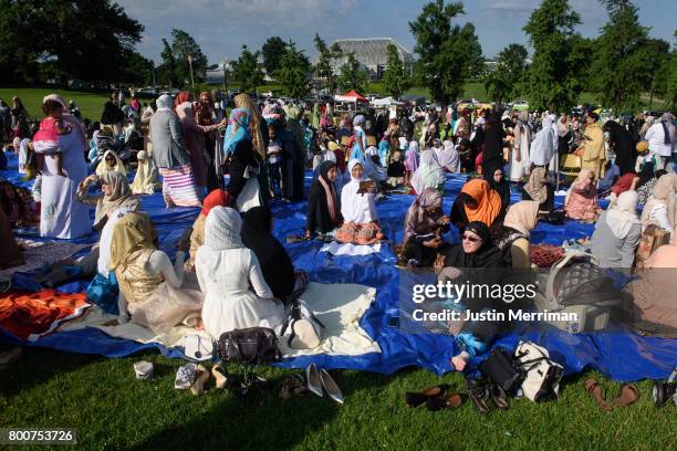 Muslim women gather to pray during an Eid al-Fitr celebration, marking the end of Ramadan, on June 25, 2017 in Pittsburgh, Pennsylvania. The...