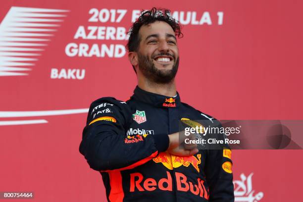 Race winner Daniel Ricciardo of Australia and Red Bull Racing celebrates his win on the podium during the Azerbaijan Formula One Grand Prix at Baku...