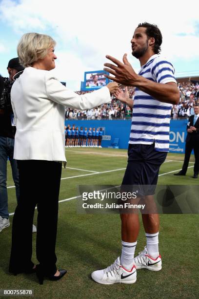Feliciano Lopez of Spain is interviewed by Sue Barker, following victory in the mens singles final against Marin Cilic of Croatia during day seven of...