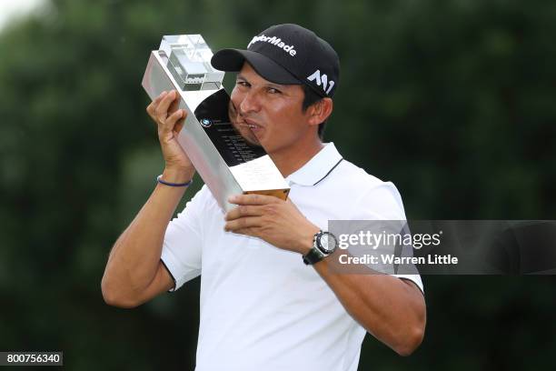 Andres Romero of Argentina poses with the trophy following his victory during the final round of the BMW International Open at Golfclub Munchen...