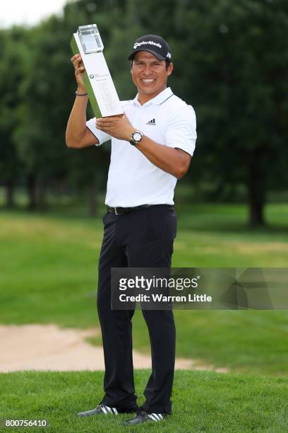 Andres Romero of Argentina poses with the trophy following his victory during the final round of the BMW International Open at Golfclub Munchen...