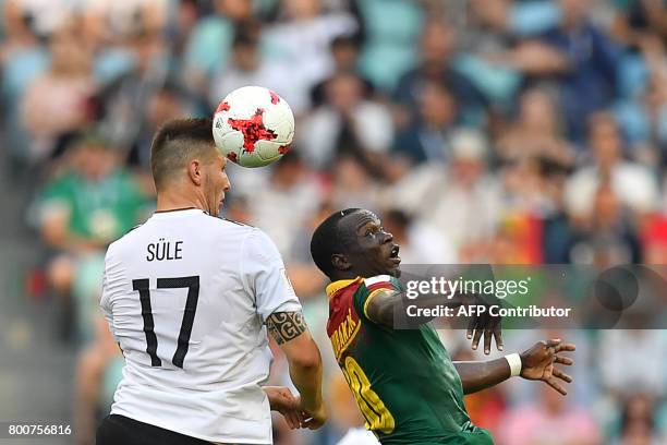 Cameroon's forward Vincent Aboubakar heads the ball with Germany's defender Niklas Suele during the 2017 FIFA Confederations Cup group B football...