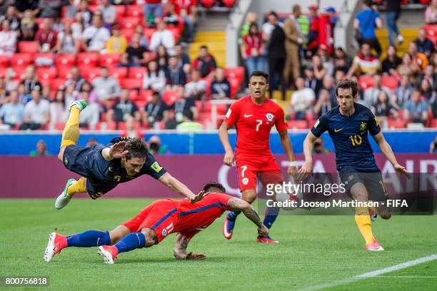 Mark Milligan of Australia clashes with Eduardo Vargas of Chile during the FIFA Confederations Cup Russia 2017 group B football match between Chile...