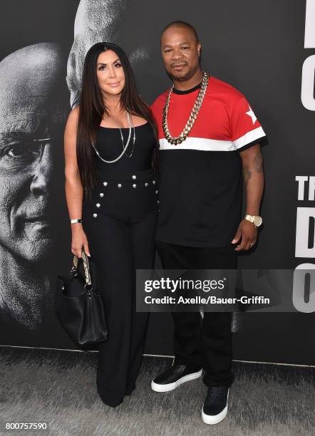 Rapper Xzibit and wife Krista Joiner arrive at the premiere of 'The Defiant Ones' at Paramount Theatre on June 22, 2017 in Hollywood, California.