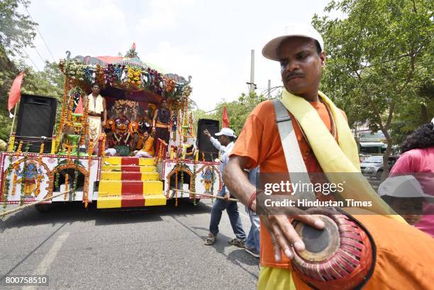 Devotees of Lord Krishna take out a procession of Lord Jagannath Ratha Yatra, chanting Hare Krishna Maha Mantra, at Sushant Lok, on June 25, 2017 in...