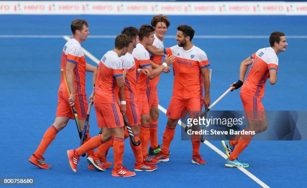 Robbert Kemperman of the Netherlands celebrates scoring their teams fourth goal with teammates during the final match between Argentina and the...