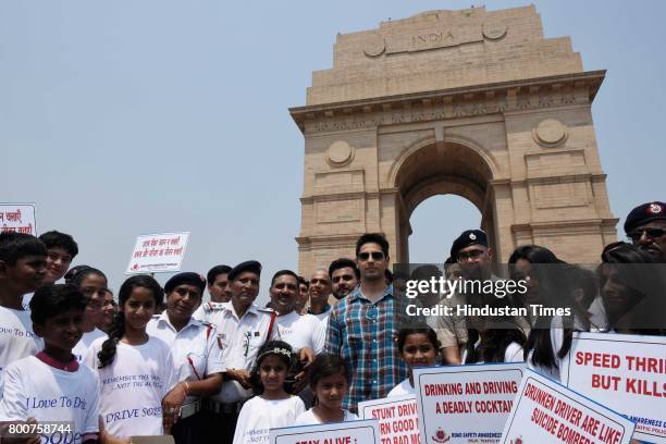 Bollywood actor Siddharth Malhotra along with school children participates during a Delhi road safety activity to spread awareness on anti-drunken...