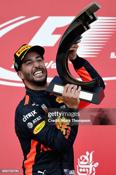 Race winner Daniel Ricciardo of Australia and Red Bull Racing celebrates his win on the podium during the Azerbaijan Formula One Grand Prix at Baku...