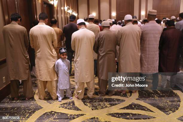 Muslims attend a prayer service celebrating Eid-al-Fitr on June 25, 2017 in Stamford, Connecticut. The Islamic holiday celebrates the end of the...