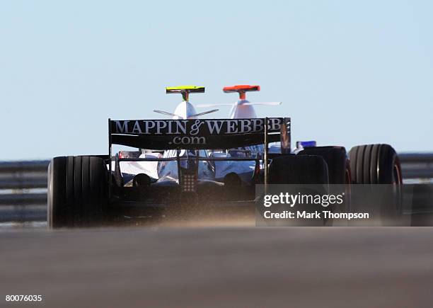 Kazuki Nakajima of Japan and Williams and Nico Rosberg of Germany and Williams in action during pre-season Formula One winter testing at the...