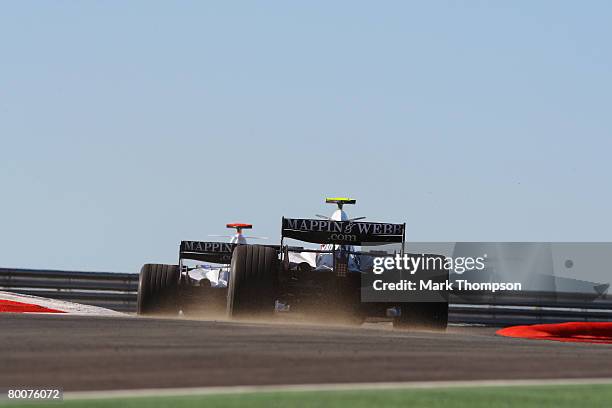 Nico Rosberg of Germany and Williams and Kazuki Nakajima of Japan and Williams during pre-season Formula One winter testing at the Monteblanco...