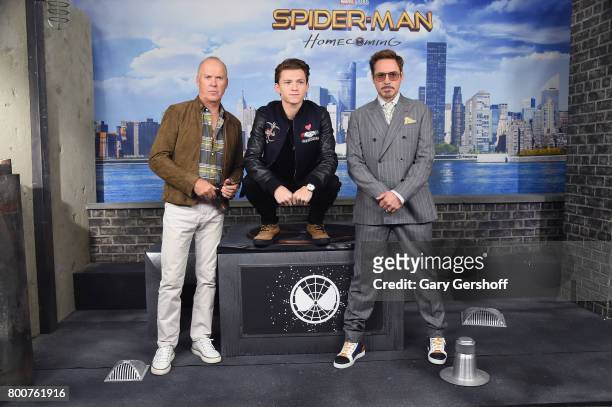 Actors Michael Keaton, Tom Holland and Robert Downey Jr. Attend the "Spiderman: Homecoming" New York photo call at the Whitby Hotel on June 25, 2017...