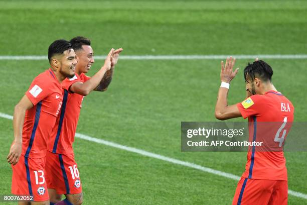 Chile's forward Martin Rodriguez celebrates scoring with team mates during the 2017 Confederations Cup group B football match between Chile and...