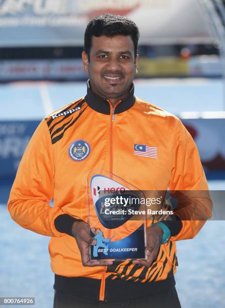 Kumar Subramiam of Malaysia poses with his Best Goalkeeper award after the final match between Argentina and the Netherlands on day nine of the Hero...