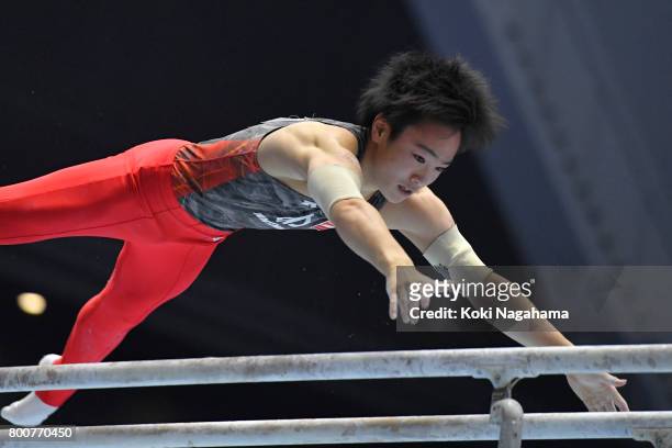 Kenta Chiba competes in the Parallel Barsduring Japan National Gymnastics Apparatus Championships at the Takasaki Arena on June 25, 2017 in Takasaki,...