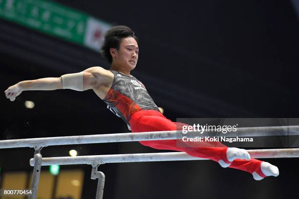 Kenta Chiba competes in the Parallel Barsduring Japan National Gymnastics Apparatus Championships at the Takasaki Arena on June 25, 2017 in Takasaki,...