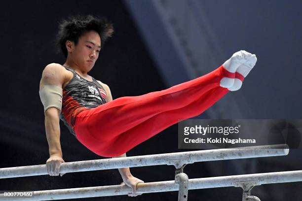 Kenta Chiba competes in the Parallel Barsduring Japan National Gymnastics Apparatus Championships at the Takasaki Arena on June 25, 2017 in Takasaki,...