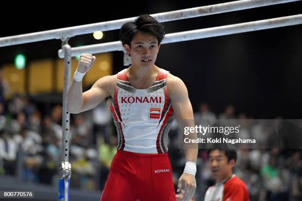 Yusuke Tanaka celebrates after competing in the Parallel Bars during Japan National Gymnastics Apparatus Championships at the Takasaki Arena on June...