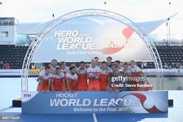 Netherlands players pose with the trophy after the final match between Argentina and the Netherlands on day nine of the Hero Hockey World League...