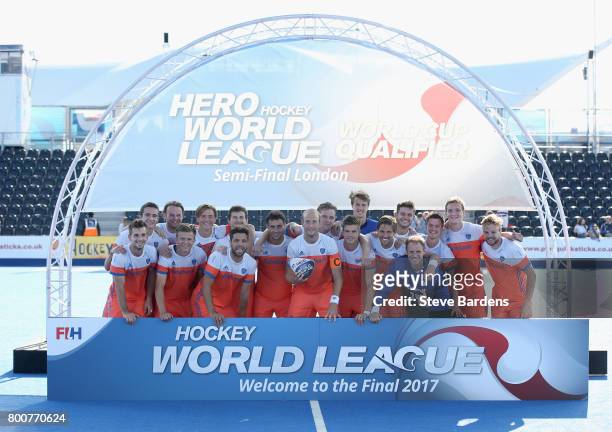 Netherlands players pose with the trophy after the final match between Argentina and the Netherlands on day nine of the Hero Hockey World League...