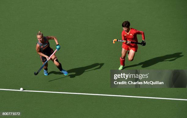 Qian Yu of China and Charlotte Vega of Netherlands during the FINTRO Women's Hockey World League Semi-Final Pool A game between China and Netherlands...