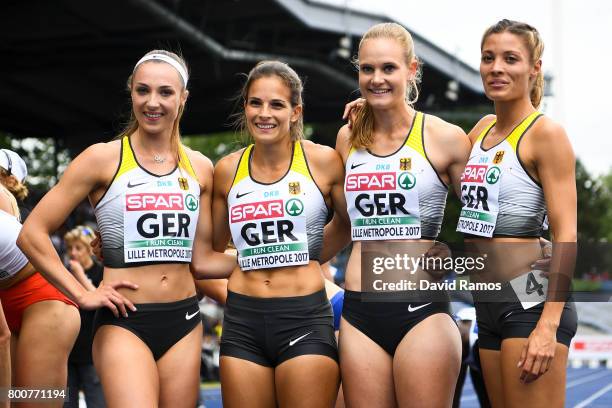 German team members Laura Muller, Nadine Gonska, Hannah Mergenthaler and Ruth Sophia Spelmeyer pose after the Women's 100m Hurdles Final during day...